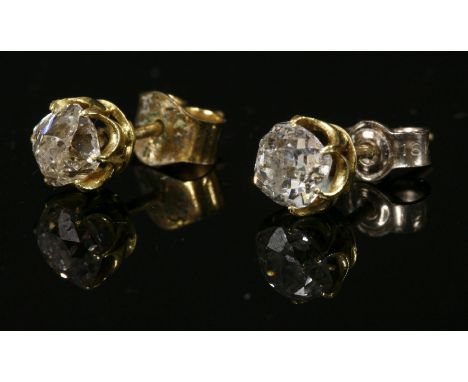 A pair of Victorian single stone diamond stud earrings,each with a cushion cut diamond, estimated as approximately 0.60ct eac