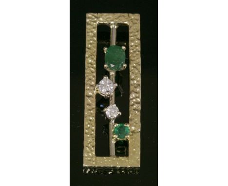 An 18ct yellow and white gold, emerald and diamond pendant,by Evan Grant.  An open rectangular portrait frame with a fine ham