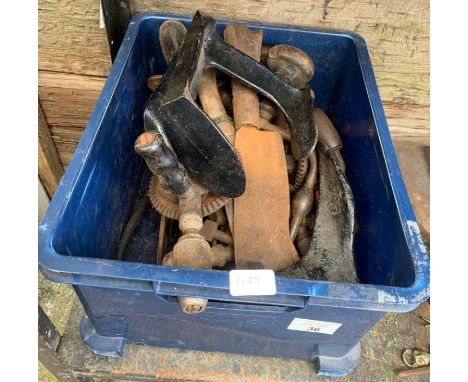 Crate of assorted tools including brass foot pumps and drills
