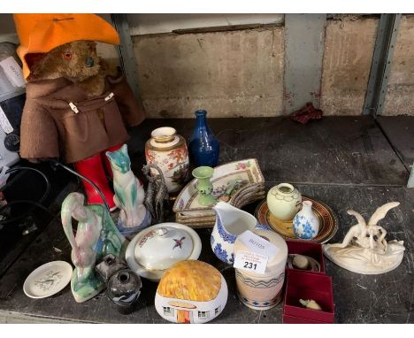 Half shelf of china ornaments with Paddington bear