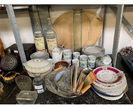 Shelf of assorted china, 2 large empty Bell whisky bottles, fans and assorted kitchen items