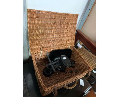 Set of vintage kitchen scales in a wicker basket