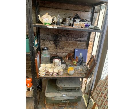 Three shelves of items to include vintage suitcases, ceramics, barometer and other items