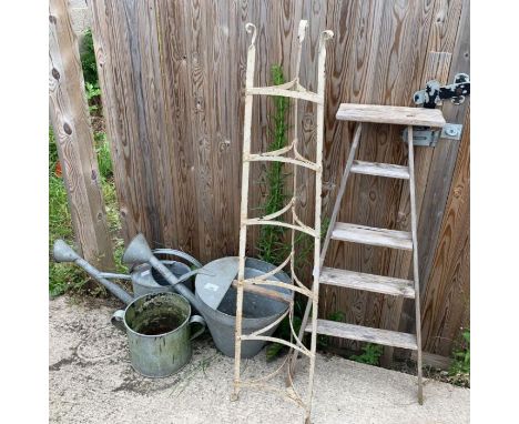 Wrought iron decorative plant stand, small picking ladder, two watering cans and galvanized plant pot