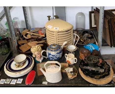 Shelf of collectables including a metal electric heater, chinaware, glassware, marbles, butter patter etc