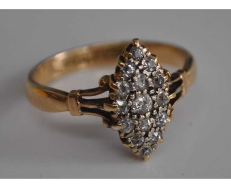 An 18ct gold diamond dress ring, the navette setting pave set with 15 stones, size I/J.