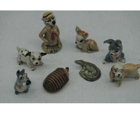A collection of Wade and other miniature pottery animal figures