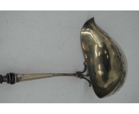 A 19th century white metal toddy ladle having ebonised handle, 42cm