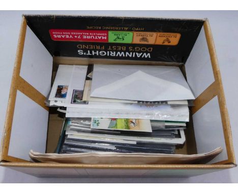 A collection of vintage postcards and first day covers 