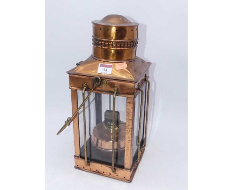 A copper hanging lantern, having interior spirit burner, h.40cm 