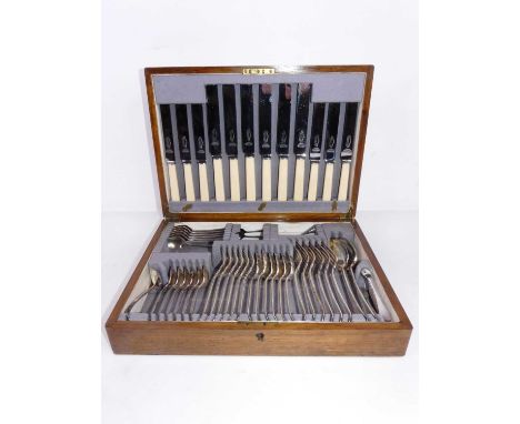 An early 20th century oak cased canteen of silver plated Old English pattern flatwareComplete.