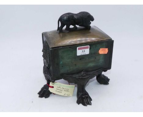 A 19th century bronze and brass table casket, of rectangular form, the domed cover surmounted by a lion, the body with portra