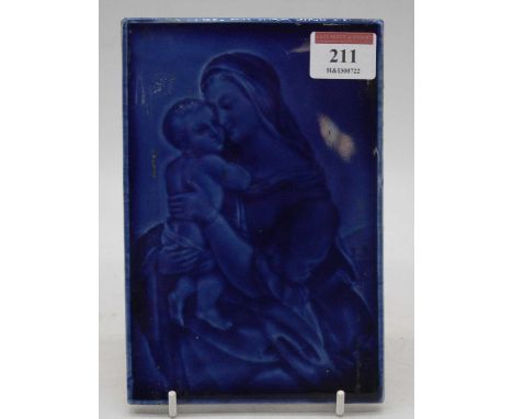 A circa 1830 French faience earthenware panel with blue glazed moulded decoration showing the Madonna and Child, The Factory 