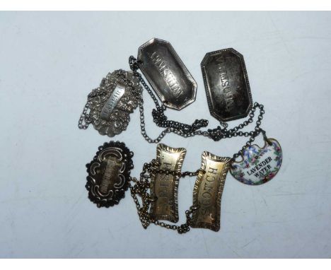 A pair of Victorian silver decanter labels, annotated for Scotch and Irish, London 1886, 0.8oz; together with four other silv