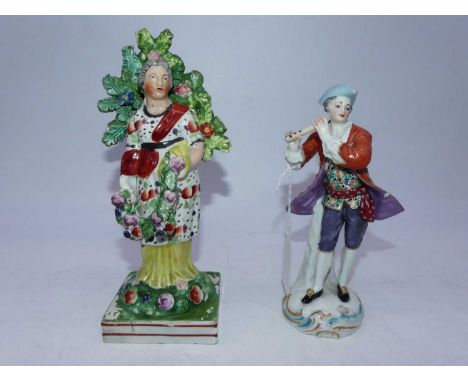 An early 19th century pearlware bocage figure, of a female in standing pose with garland of flowers in her hand, on naturalis