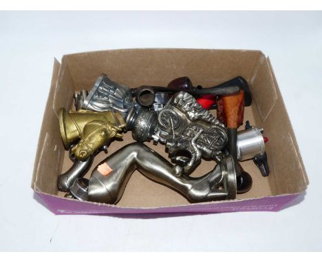 A collection of vintage novelty lighters and pipes 