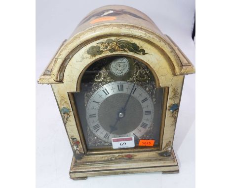 A 20th century mantel clock, in the 18th century style, the cream painted dome topped case with chinoiserie decoration, housi