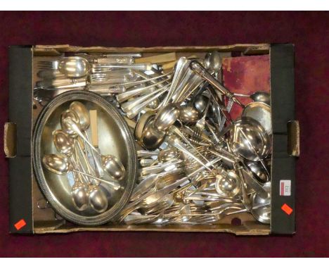 A box containing silver plated wares to include a cheese scoop, entree dish, and various flatware 