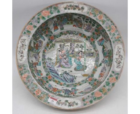 A large 19th century Chinese export bowl in the Famille Rose pallet, the centre enamel decorated with an Emperor and attendan