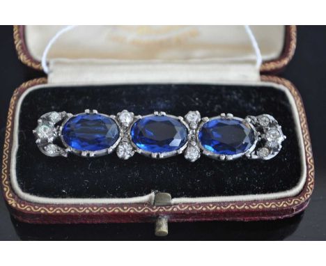 A vintage white metal and paste set bar brooch 52mm, in fitted caseCondition appears good.