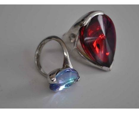A ladies Baccarat silver dress ring, set with a large pear shaped red crystal, stamped Baccarat T53, size L/M, together with 