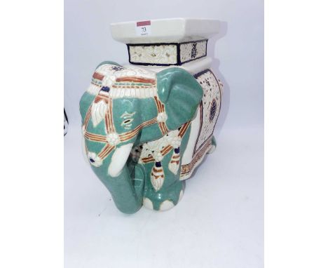 A reproduction ceramic plant stand in the form of an elephant, h.35cm