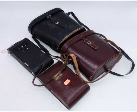 Two pairs of vintage cased binoculars; together with two vintage cameras 