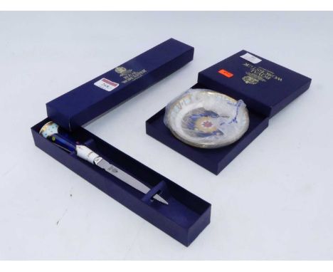 A Royal Worcester Millennium Celebration paperknife having stainless steel blade and ceramic handle, in fitted box, together 