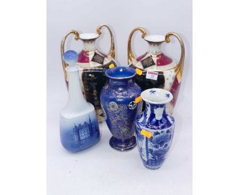 A pair of early 20th century Vienna style porcelain vases, each of amphora shape, the central panel decorated with two figure