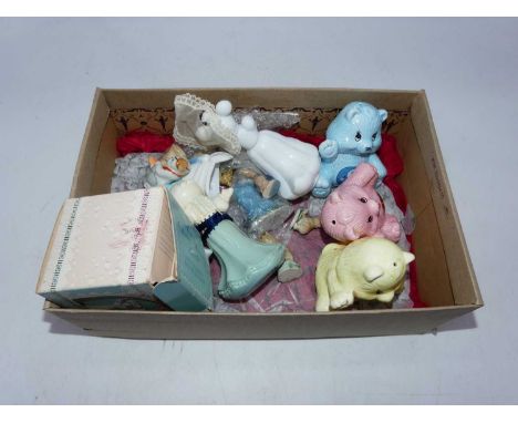 A collection of ceramic animal figures, to include Care Bears 