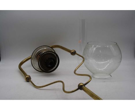 A Victorian brass hanging oil lamp, h.83cmNo shade. Font and chimney in tact.