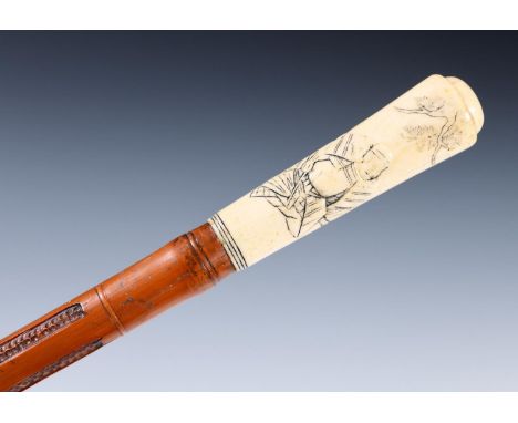An early 20th century walking stick, with carved ivory handle, carved with Japanese scene with figure, bamboo shaft carved wi