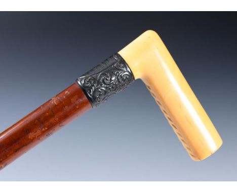 A 19th century walking stick, with carved ivory handle, silver mount, 89 cm, and another 90 cm 