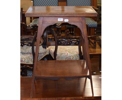 An early 20th century mahogany card table, on square tapering legs, united by undertier, 56 cm wide, and three mahogany parlo