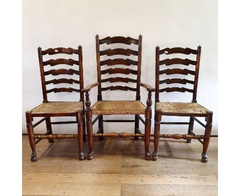 A pair of early 20th century oak hall chairs,  another pair, set of five oak ladder back dining chairs, and an elm Windsor ch