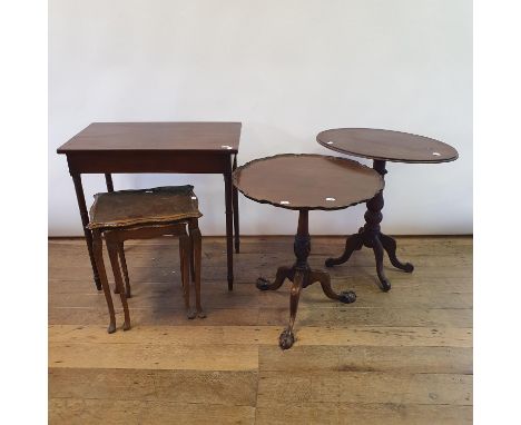 A George III style mahogany wine table, 58 cm diameter, a commode, a nest of two tables, an oval wine table, and a side table