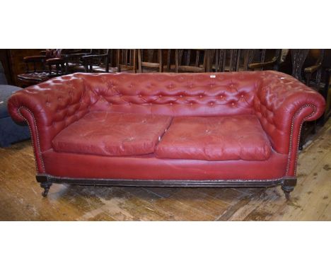 A red leather upholstered Chesterfield sofa, 190 cm wideReport by RBDeceased estate, from a very damp room and damp affected,