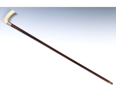 A 19th century walking stick, with carved ivory handle, silver mount, 89 cm, and another 90 cm 