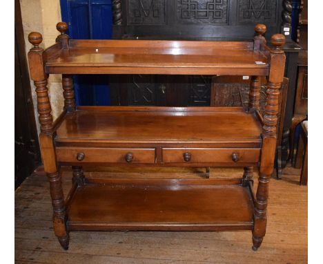 A 19th century mahogany three tier buffet, the central shelf with two drawers, 105 cm wide 