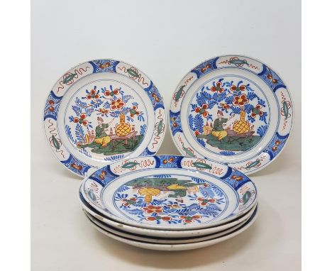 A set of six Dutch Delft polychrome plates, decorated figures and foliage, some fritting, 23.5 cm diameter (6) 