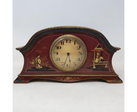 A 1920's mantel clock, with Arabic numerals, in a red lacquer case with Chinoiserie style decoration, 27 cm wide 