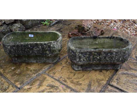 A pair of reconstituted stone rectangular garden planters, decorated with a continuous procession of figures, 24 cm  high x  