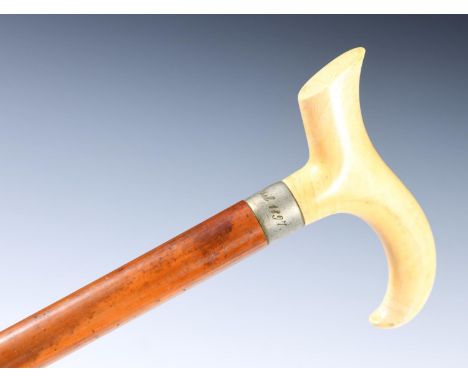 An early 20th century walking stick, with ivory handle, 9ct gold mount, 90 cm and three other similar walking sticks (4) 