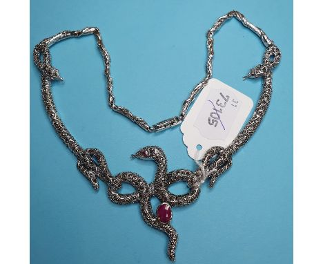A silver, marcasite and ruby set snake necklace 