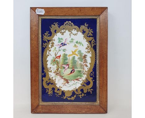 A 19th century Sevres style porcelain plaque,  central cartouche, decorated with landscape and exotic birds, highlighted in g