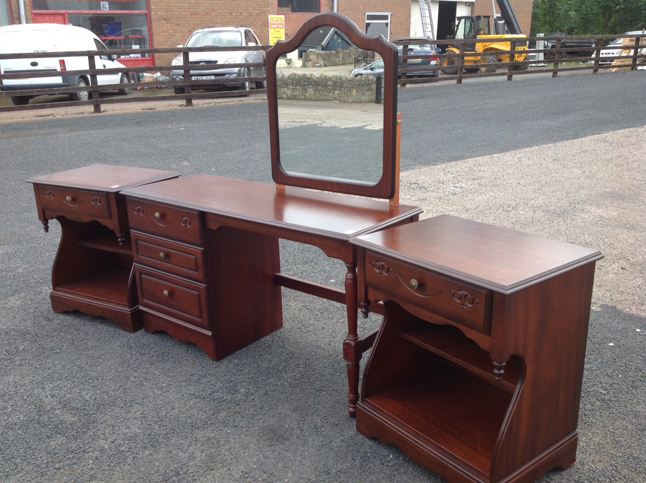 A Rossmore mahogany dressing table, and with a pair of matching bedside