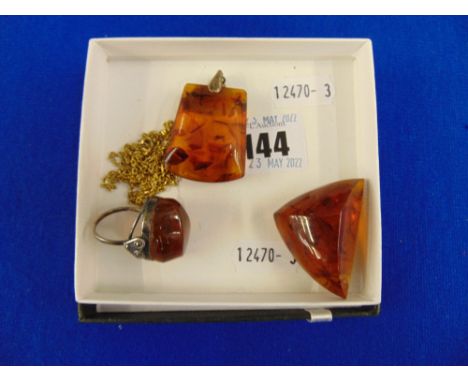 Three Amber items, inc. ring, pendant and brooch