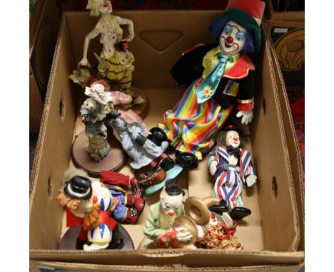 A box of figurines, formed as clowns to include ceramic examples etc.