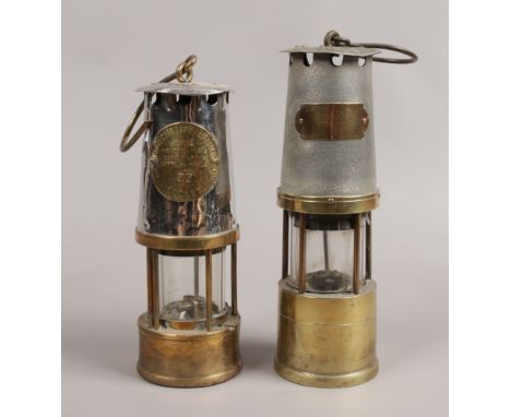 An Eccles type 6 miners lamp, along with a J. H. Naylor Limited example.