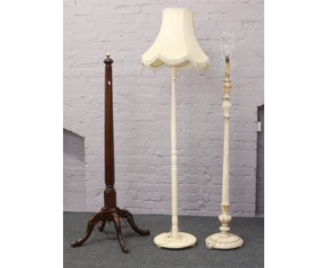 A mahogany octagonal standard lamp raised on cabriole legs, along with two painted standard lamps.